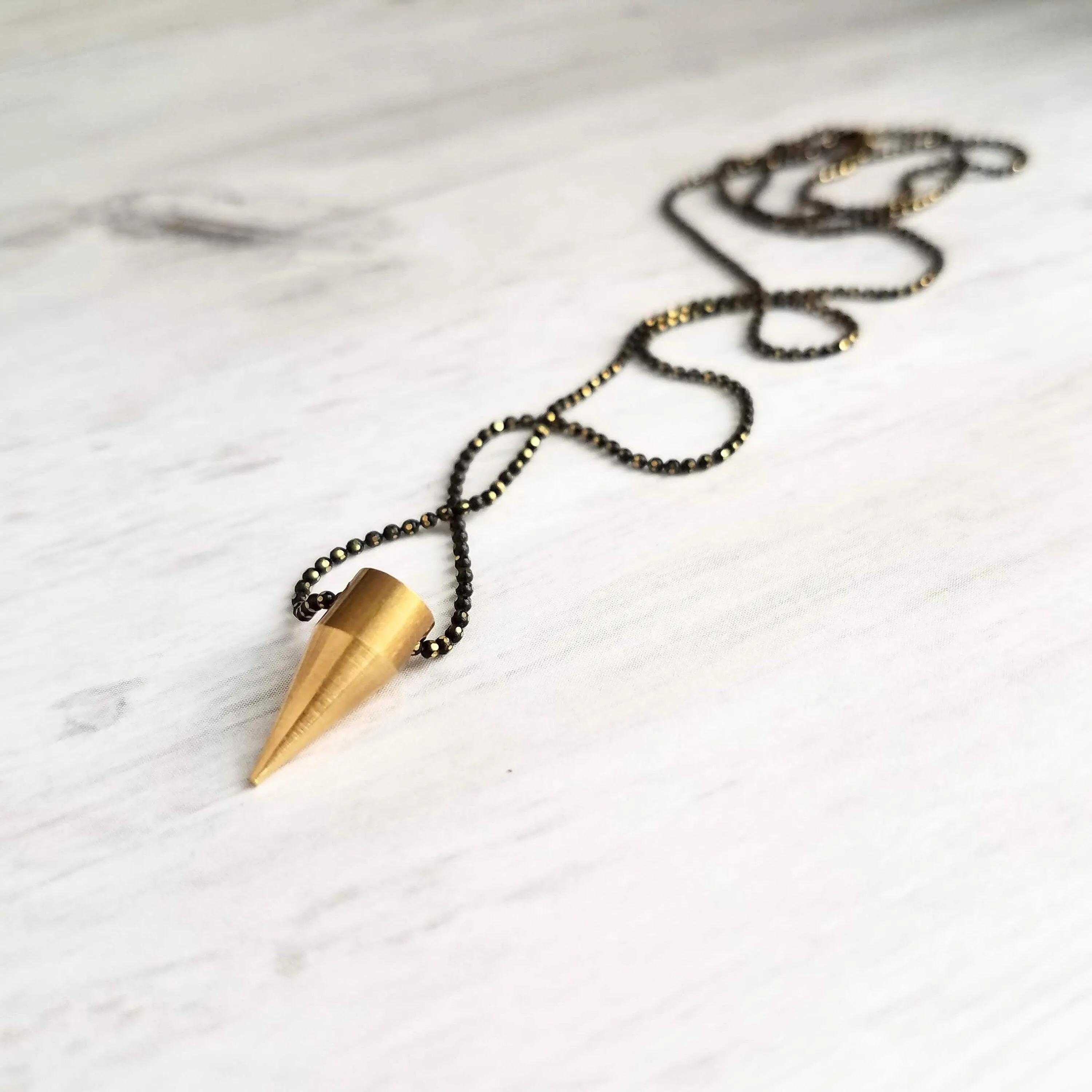 Gold Spike Necklace, solid brass bullet point pendant, gold dagger necklace, black chain necklace, black gold necklace, gold bullet necklace